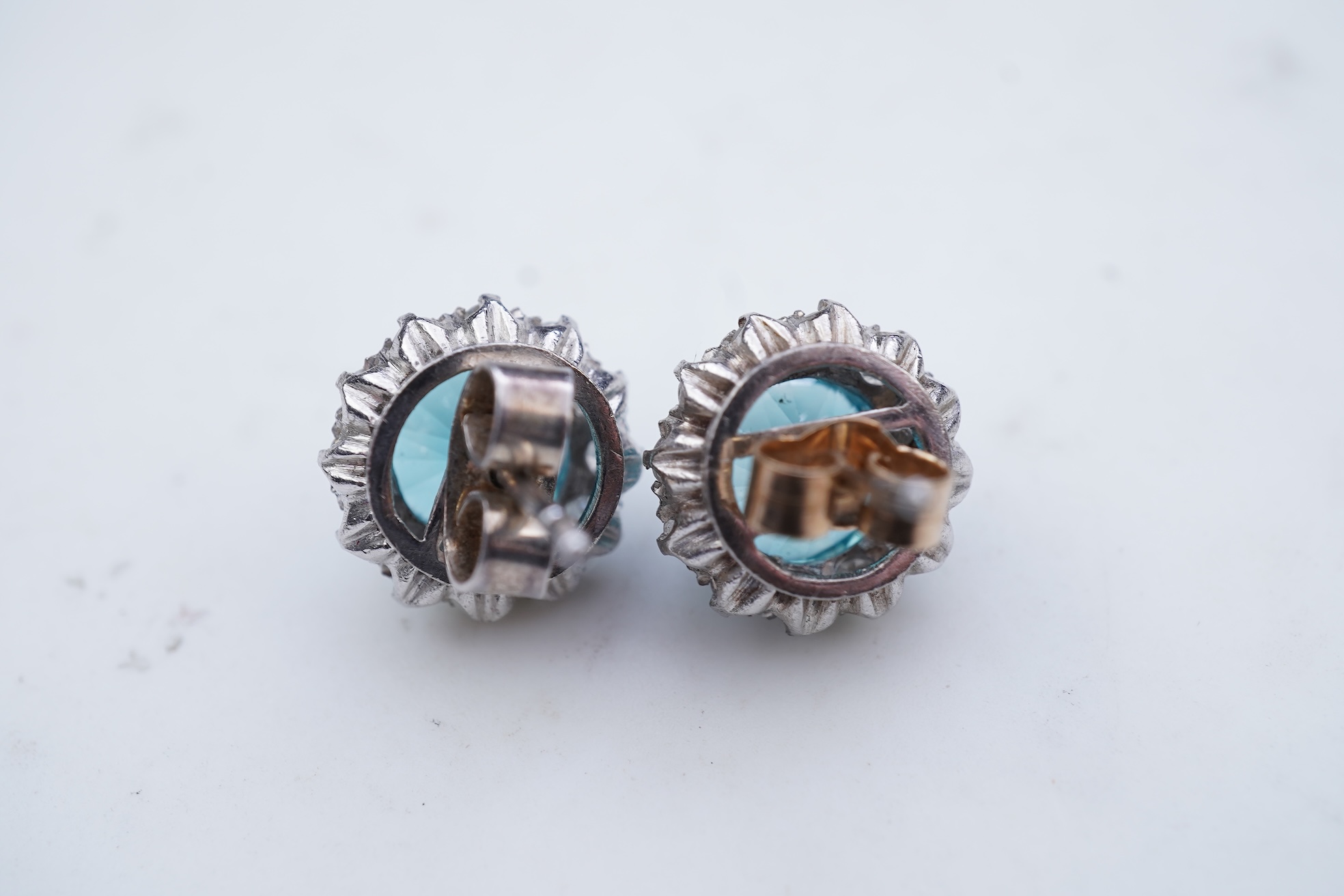 A pair of zircon and diamond earrings, mid 20th century